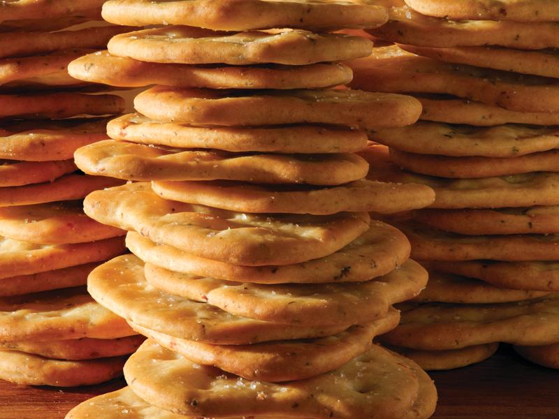 Close-up side view of three stacks of crackers.