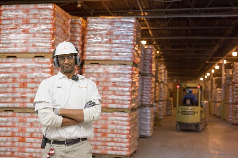 warehouse male crossed arms pallets
