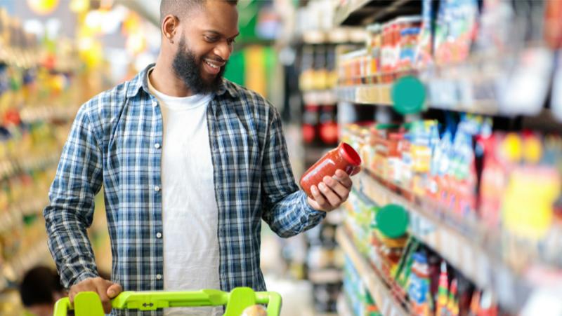 stock image - man shopping in grocery store
