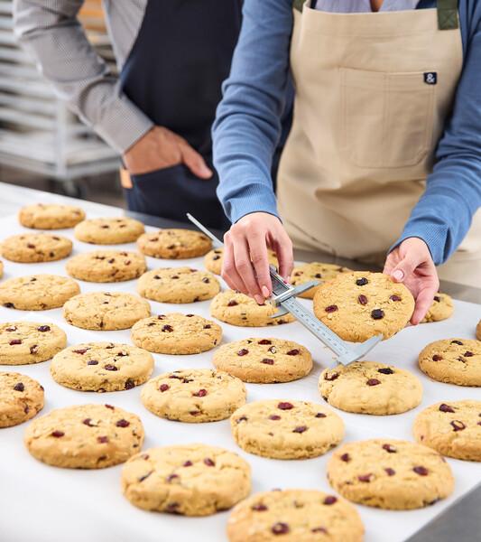 Purpose Powered Innovation shoot for PPI communication. Tabletop features Sustagrain cookies in an R&D lab.