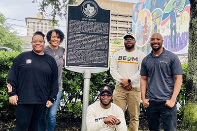 B.E.A.M. members smiling at an event